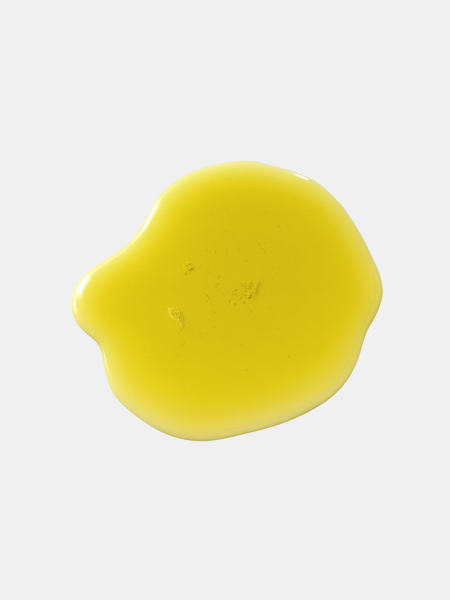 Texture de l’Huile Sèche Restructurante NutriRepair d’Unlëss Cosmetics déposée en goutte sur fond blanc.